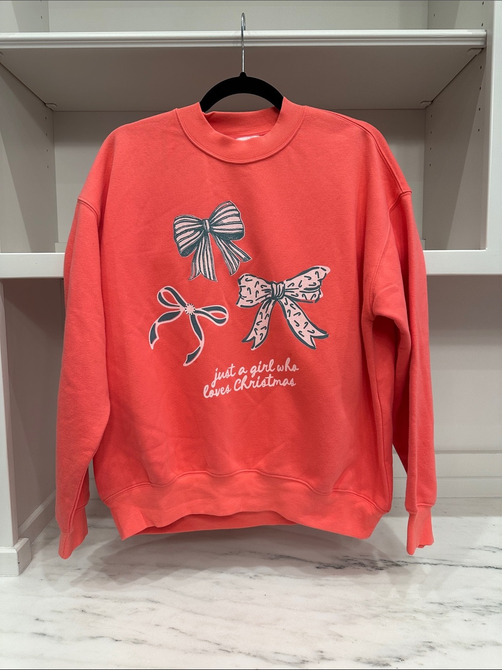 Pink Lily small coral sweatshirt. Just a Girl Who Loves Christmas logo. Like new